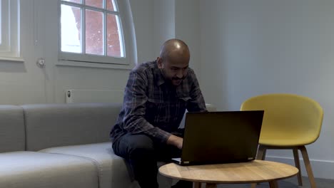 Middle-Aged-Asian-Family-Man-Working-from-Home-on-Laptop