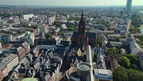 high above the city of frankfurt the spire of the largest religious building