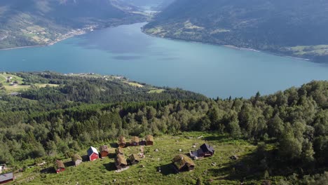 raksetra between stryn and loen norway - sunny day aerial with mountain cabins and fjord view