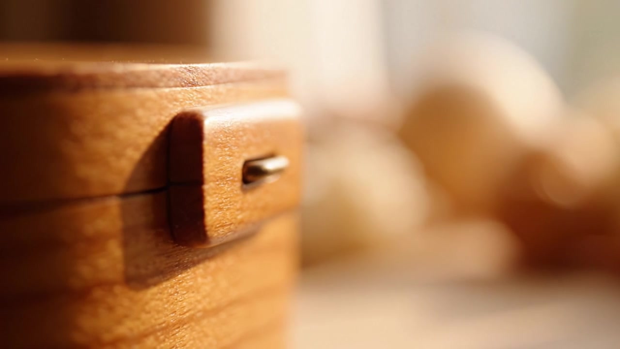 Close-Up of a Beautifully Crafted Wooden Box with Natural Light Creating a Warm Atmosphere, Ideal for Showcasing Craftsmanship and Design