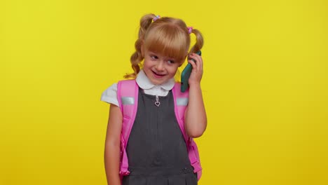 Pupil-schoolgirl-making-mobile-phone-call-to-mother,-discussing-very-pleasant-and-interesting-topic