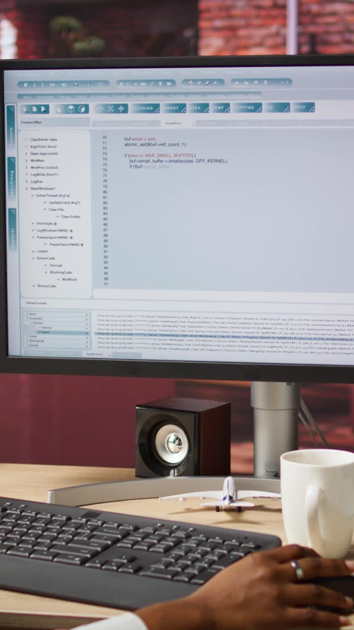 Vertical video Woman in home office looking at UI on PC screen, typing code