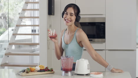 woman enjoying a healthy smoothie in the kitchen