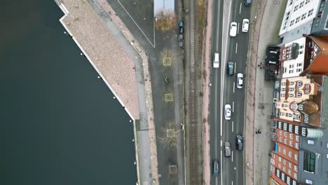 Drone-Flight-over-the-streets,-next-to-the-harbour-of-the-historic-city-in-Flensburg,-Germany