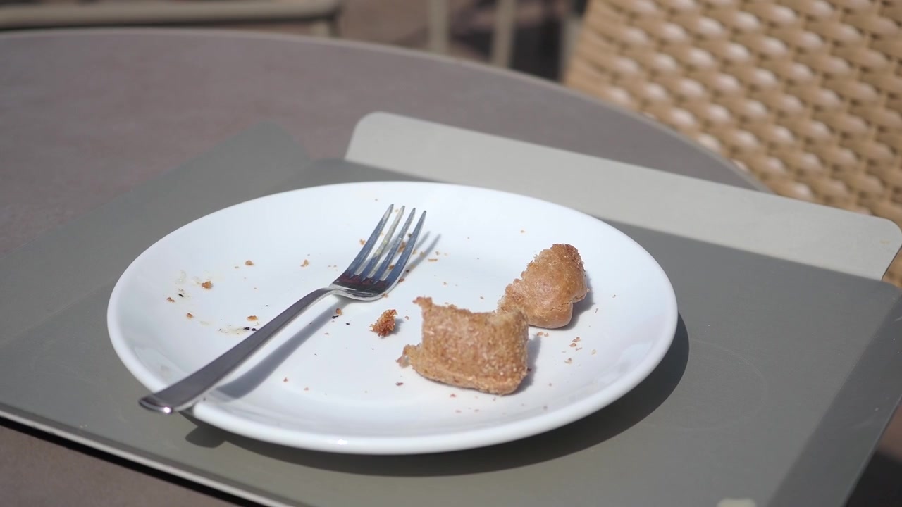 Leftover Pastry Pieces on a White Plate with a Fork