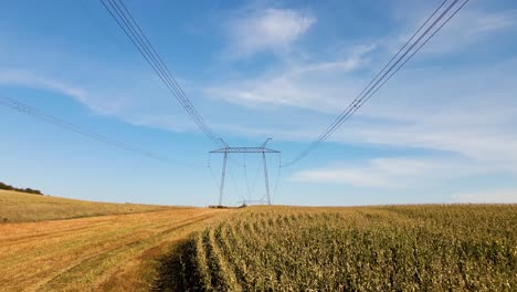 high voltage tower with electric power lines transfening electrical energy through cable wires