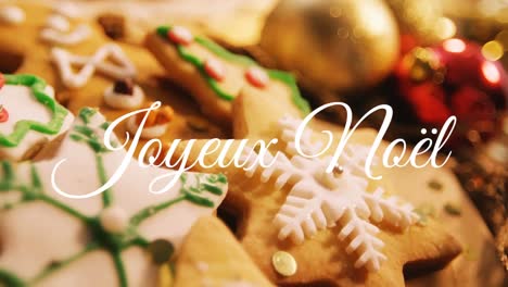 joyeux noã«l written over christmas cookies