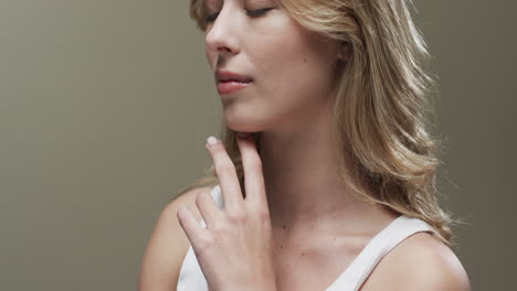 portrait of caucasian woman with blond hair, copy space, slow motion