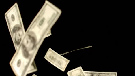 Dollars-blowing-on-black-background