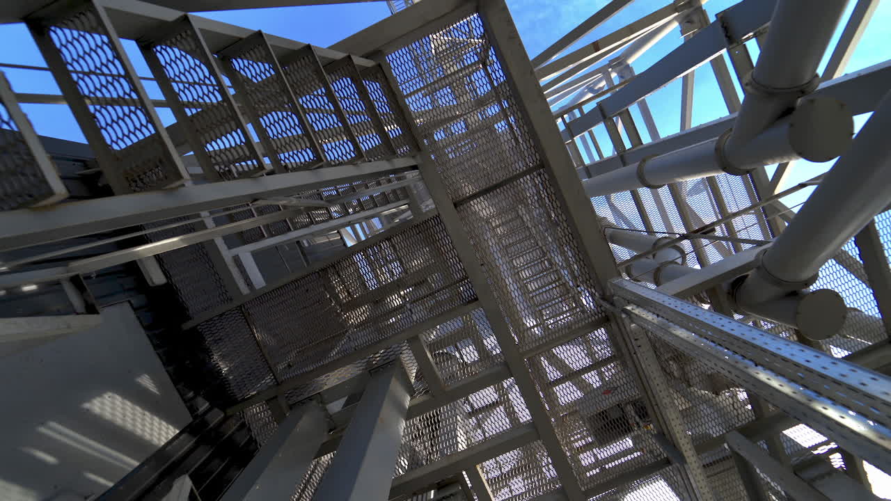 Steel construction of modern factory. Modern storehouse construction with metal structures of frame. Structural steel structure of new commercial building.