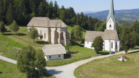 forward aerial drone shot of historical church in slovenia