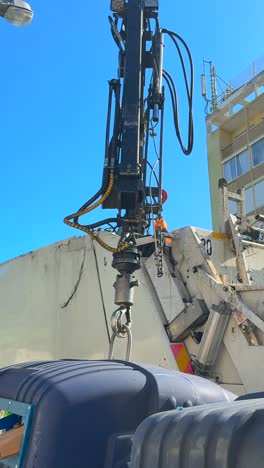 hydraulic arm of a garbage truck