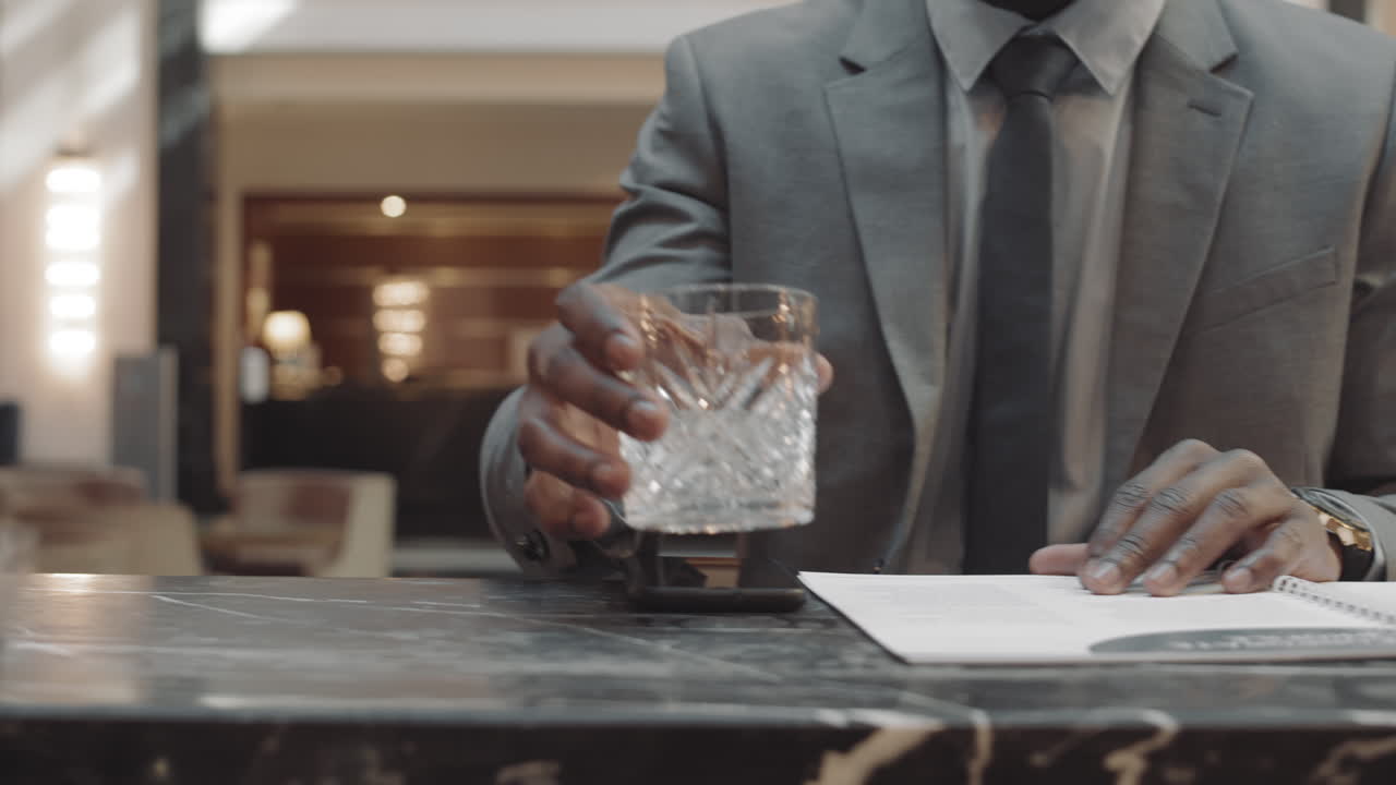 People Working and Drinking in Bar
