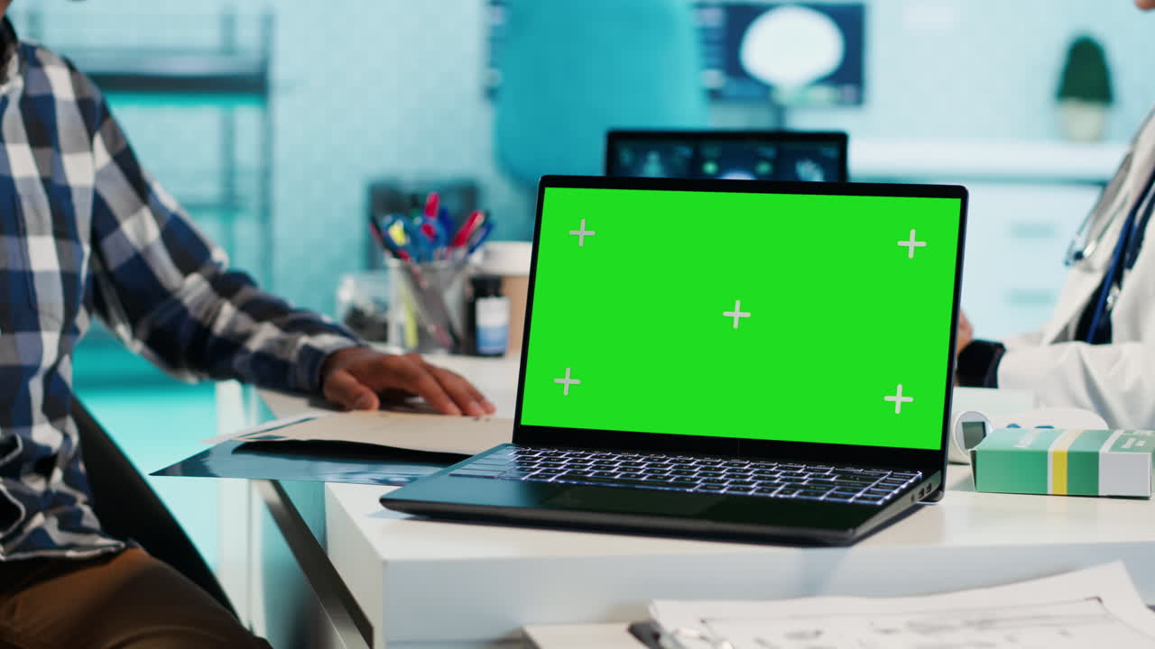 Laptop with green screen in medical office