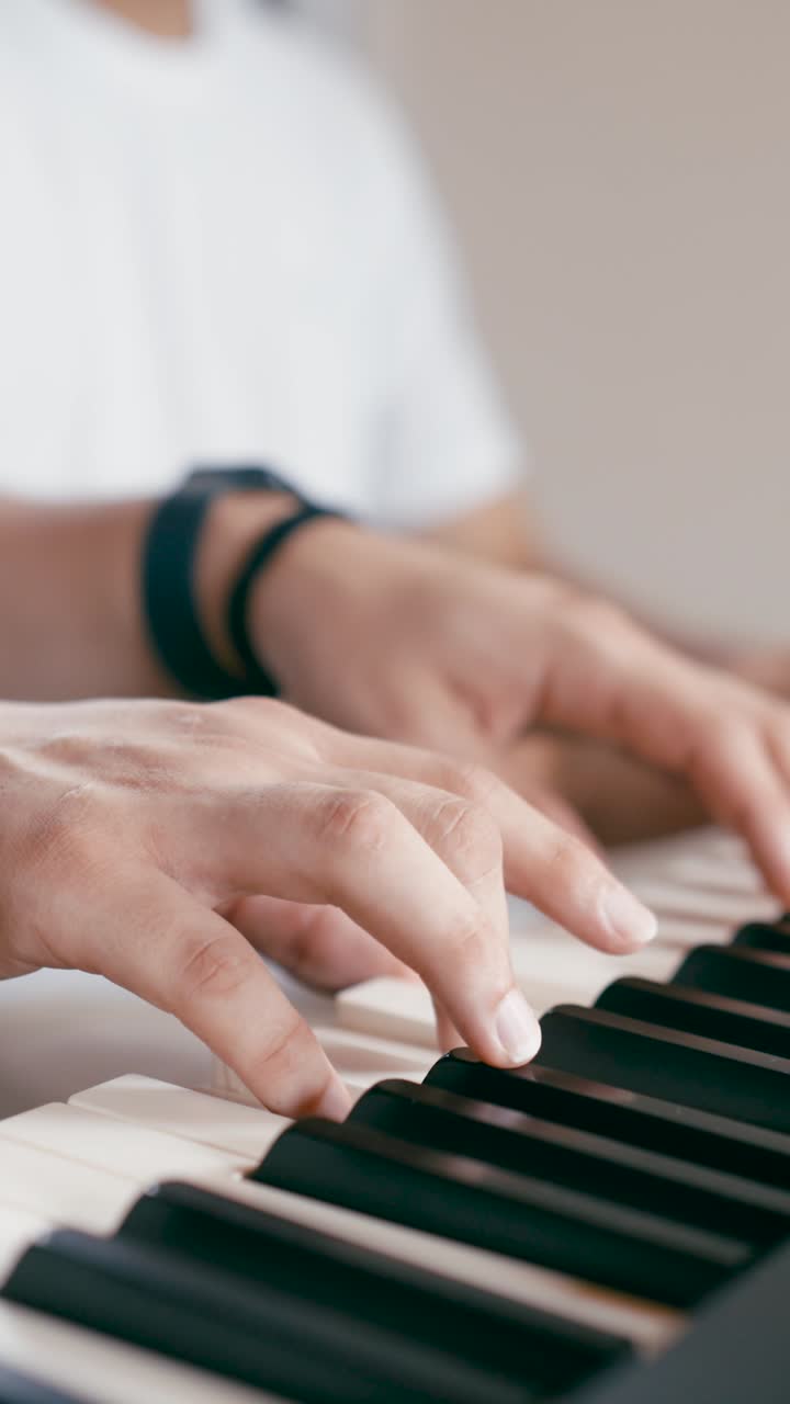 Hands playing piano