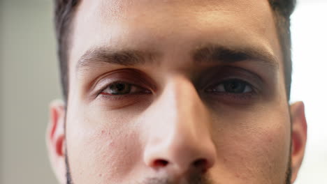 close-up of thoughtful man looking ahead, focusing on something important