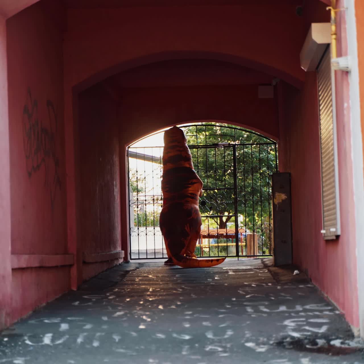 Dinosaur walking in alley