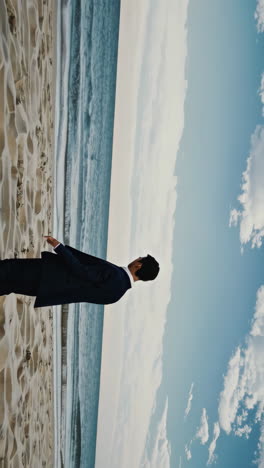 man in a suit on the beach