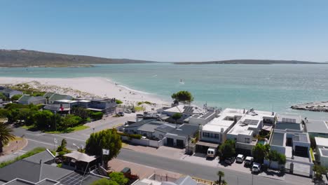 aerial view of langebann city in south africa. sunny day with housing area and modern apartments at sandy beach. wide shot.