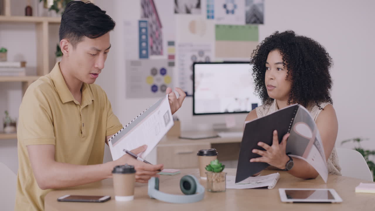 Businesspeople discussing reports in meeting