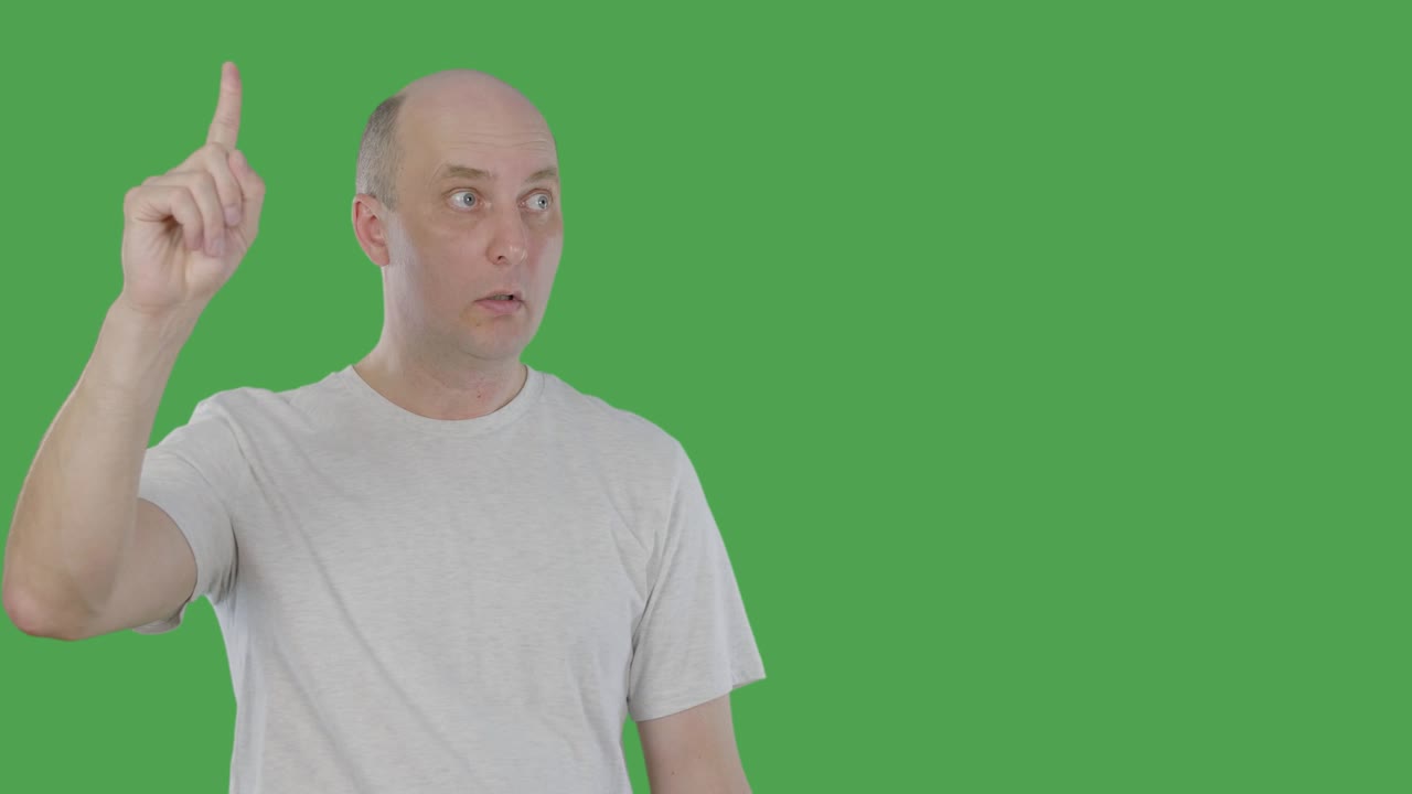 Emotional man thinking, guessing and pointing up with idea. Alphachannel, keyed green screen