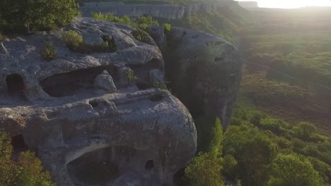 aerial view of ancient cave dwellings in rocky terrain