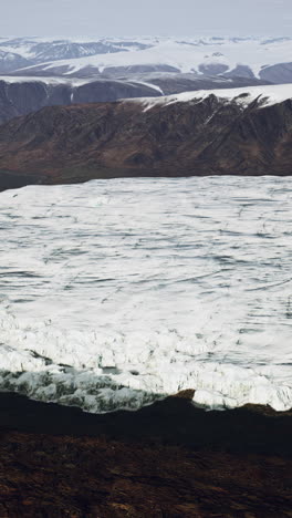 aerial view of a glacier in a mountainous region