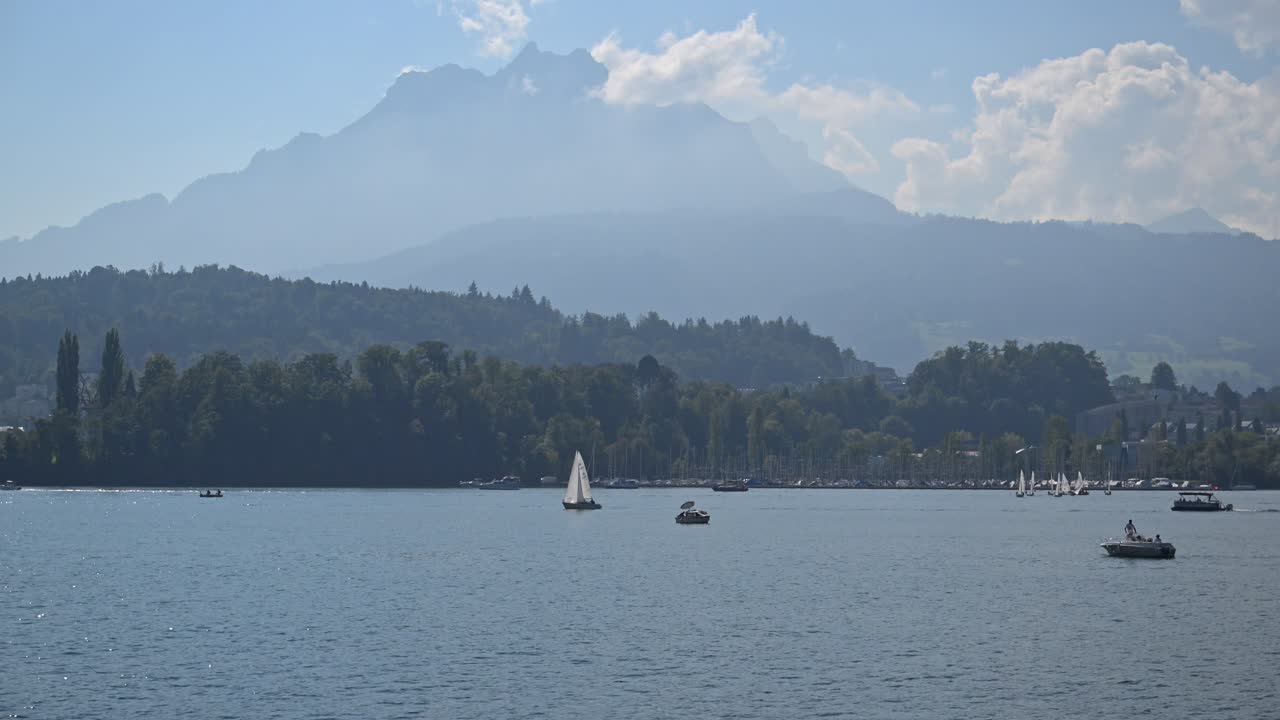 Scenic Lake View with Sailboats and Mountains in Switzerland