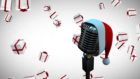 animación del sombrero de santa en un micrófono vintage con regalos de navidad cayendo sobre un fondo blanco
