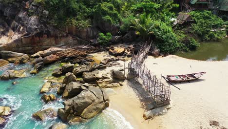 haad than sadet beach, old wooden pier and fishing boats on the sand