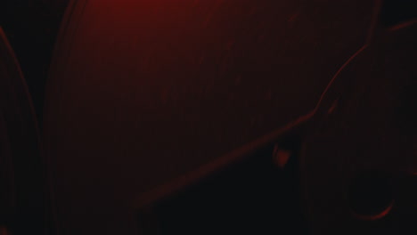 a close-up on a vintage tape recorder in a red blinking light