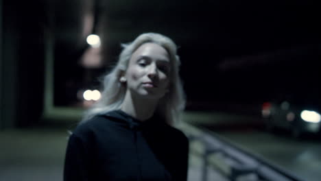 confident walk woman night highway in urban background at city lights.