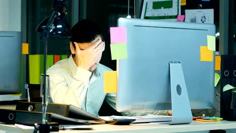 tired businessman work at office. business having many thing to do and he work all day all night.