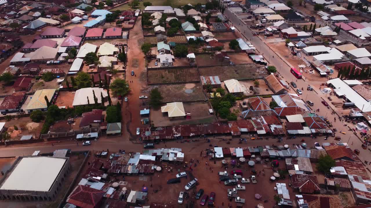 Colorful Karshi houses and vibrant market life seen from aerial drone shot Abuja
