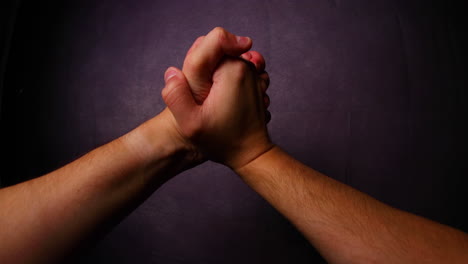 Men's-hands-come-together-close-up-gesture-captured-from-left-side-looking-gracefully-in-front-of-camera-Fisheye-perspective-with-daylight-all-capture-in-4K-60fps-slow-motion-movement