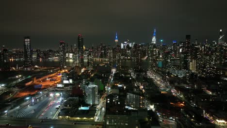 an aerial view from high over long island city, new york at night