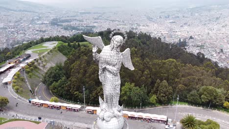 aerial drone of panecillo quito capital city in the andes mountains in ecuador. cityscape aerial of famous statue in ecuador