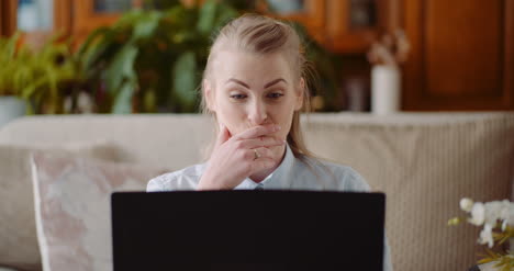 smiling woman working on laptop 2