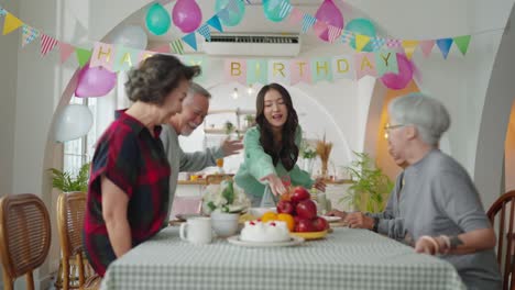 birthday party at senior daycare,group of asian female elder male female laugh smile positive conversation greeting in birthday friend party at nursing home senior daycare center senior woman birthday