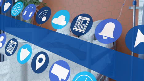 in hospital, digital icons overlaying person in bed, showing healthcare animation