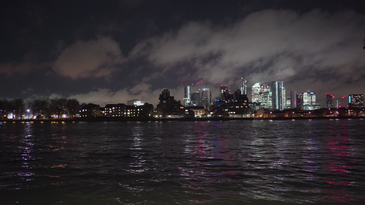 Canary Wharf view from Greenwich London across the Thames River at night.