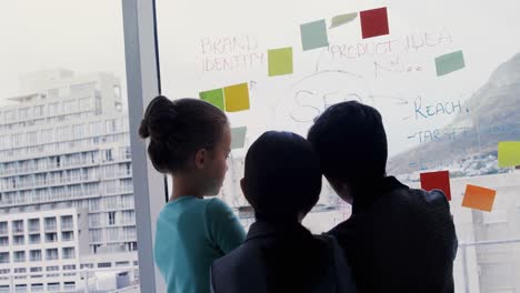 kids as business executives discussing over whiteboard 4k