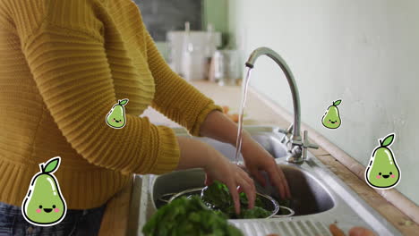 Animation-Von-Birnensymbolen-über-Einer-Kaukasischen-Frau,-Die-Salat-Wäscht