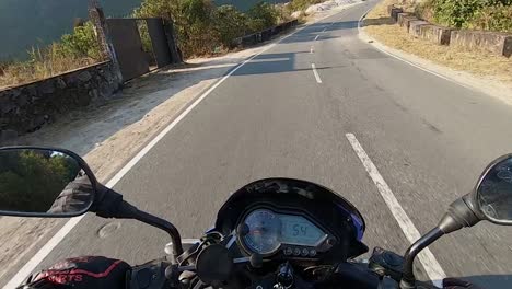 motorcycle-rider-view-of-different-mountain-curvy-road-landscape-at-day-video-is-taken-at-dawki-meghalaya-north-east-india-on-July-06-2023