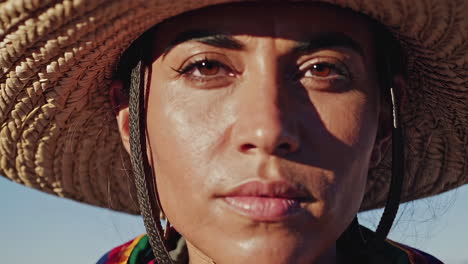 close-up portrait of a woman wearing a straw hat