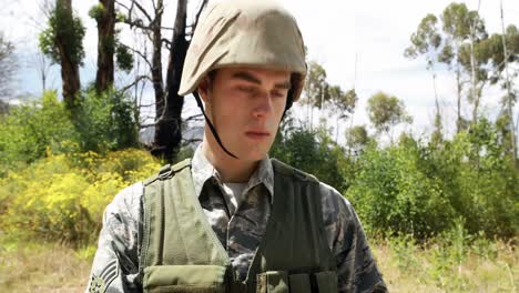 military soldier using digital tablet during training exercise