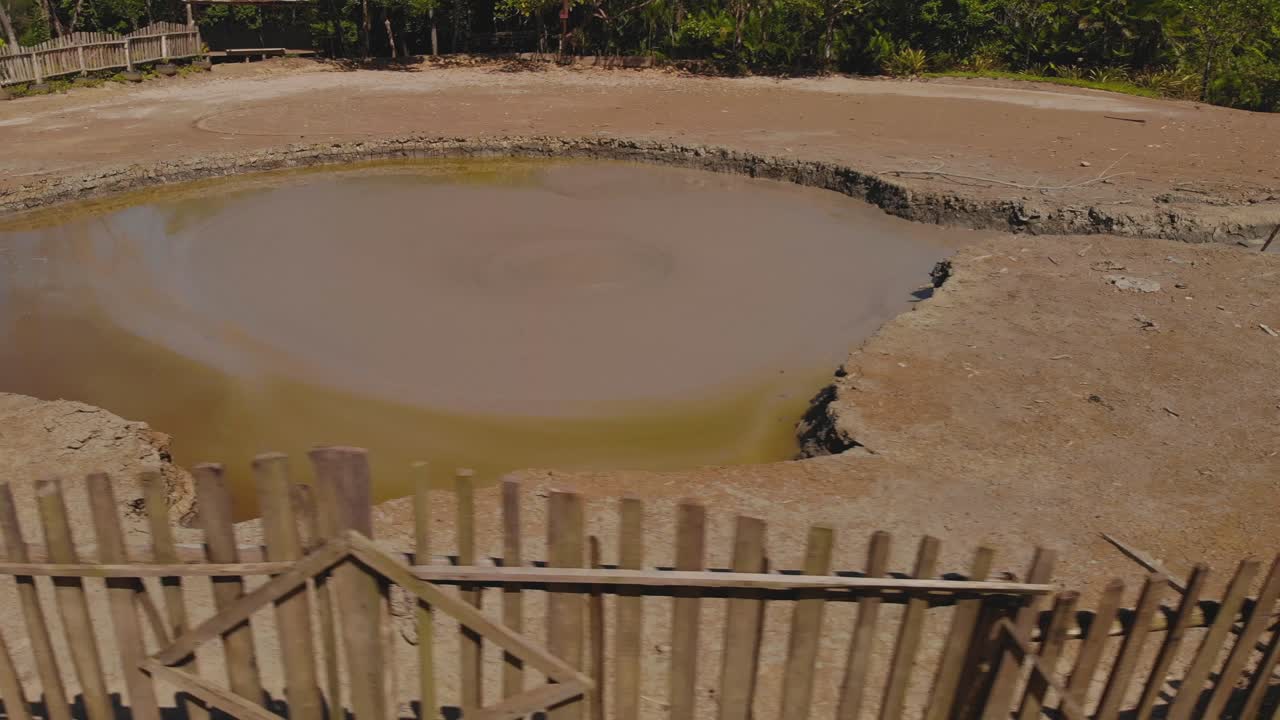 Closeup of L'eau Michel mud volcano bubbling from the center of the cone in Bunsee Trace penal, Trinidad and Tobago