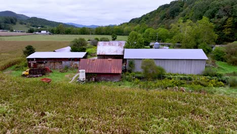 old homestead and cornfield aerial in appalachia near mountain city tennessee