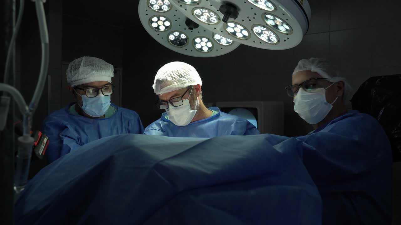 Surgical team performing an operation in an operating room