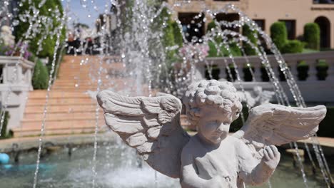 water streams over a serene angel statue